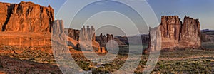 Three Gossips Rock Formation in Arches National Park at Sunrise photo