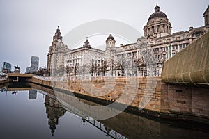 Three Graces reflecting in the canal