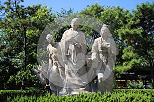 Three granite sculpture of the ancients photo