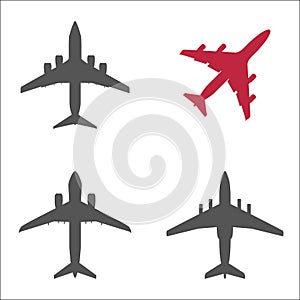 Three gray passenger planes and one red