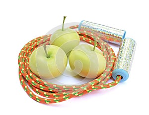 Three green apples and a bright rope