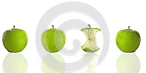 Three green apples and one apple core