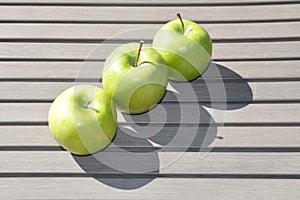 Three green apples