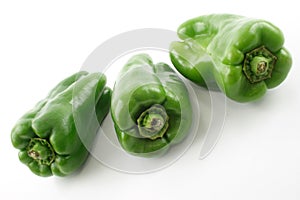 Three green bell peppers