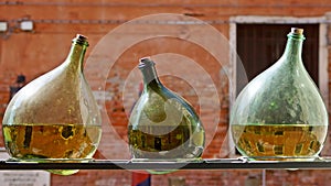 Three green bottles with reflection of Venice, Italy photo