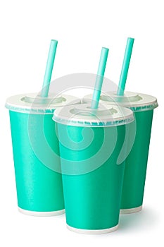 Three green cardboard cups with a straws