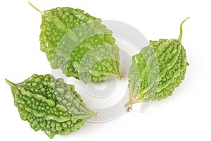 Three green momordica or karela isolated on white background