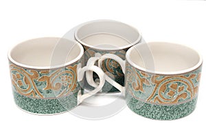 Three green printed teacups photo