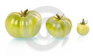 Three green tomatoes vegetables isolated