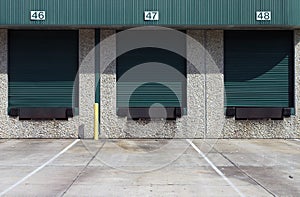 Three green warehouse loading bays photo