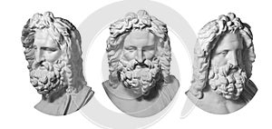 Three gypsum copy of antique statue Zeus head isolated on white background. Plaster sculpture man face with beard.