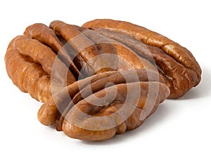 Three half a pecan kernel on white background. Full depth of field.