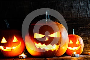 Three Halloween Pumpkins and candles