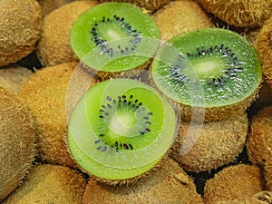 Three halves of ripe juicy kiwi.
