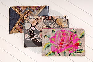 Three handbags with embroidery, clutchs