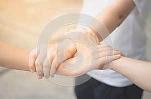 Three hands in cooperation in the work