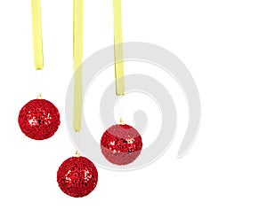 Three hanging Christmas or holiday ornaments