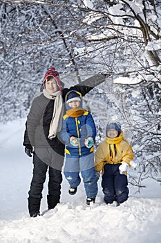 Three happy boys in forest