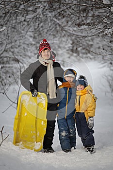 Three happy boys in forest