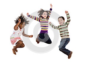 Three happy children jumping at once