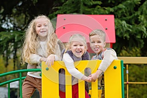 Three happy kids having fun together