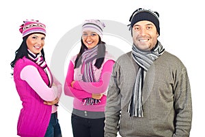 Three happy models in winter clothes
