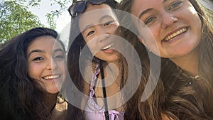 Three happy multicultural teenage girls