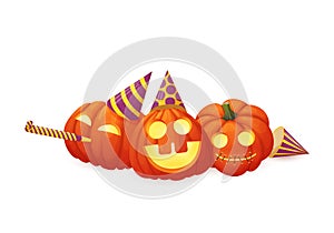 Three happy pumpkins in party hats with party blowout isolated on a white background.