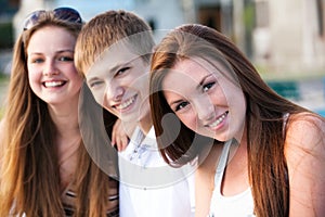 Three happy young teenagers