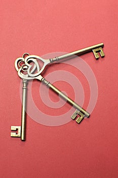 Three heart shape gold keys - vertical.