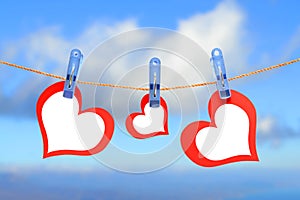 Three hearts drying on the rope