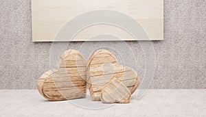 Three hearts, two large and one small wooden. 3d render