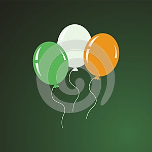 Three helium flying balloons of green, white and orange colors.