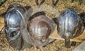 Three helmets with nose protection as worn by medieval knights in the Middle Ages