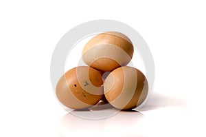 Three hen eggs isolated on white background.