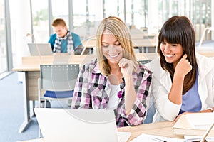 Three high school students in classroom