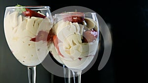 Three hight glasses with tasty white mousse creamy dessert