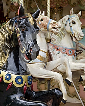 Three horses on fairground carousel
