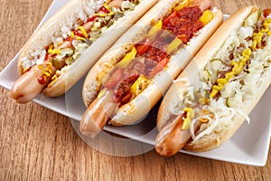 Three hot dogs closeup photo