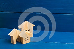Three houses on a blue background. Buying and selling of real estate, construction. Apartments and apartments. City, settlement. M