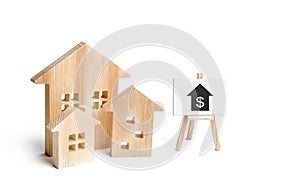 Three houses and a sign on a white background. Buying and selling of real estate, construction. Apartments and apartments.