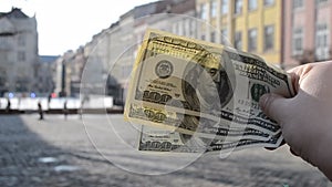 Three hundred dollar bills on blurred background of european old ancient