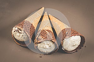 three Ice cream cone with chocolate/three Ice cream cone with chocolate, top view