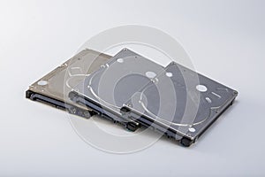 Three 2.5-inch mechanical hard drives close-up