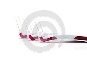 Three interdental brush with cover on white background with copy space