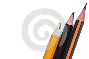 Three isolated graphite simple pencils on a white background close-up. Pencil broken