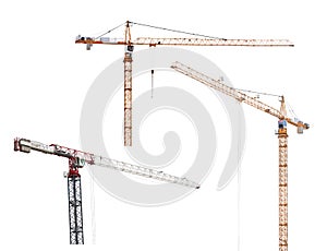 Three isolated hoisting industrial cranes photo