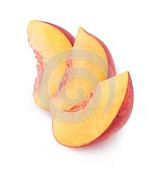 Three isolated pieces of peach fruit in a row on top of each other