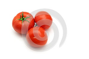 Three isolated tomatoes