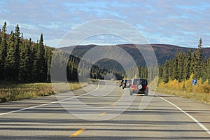 THREE JEEPS ON HIGHWAY IN CONVOY